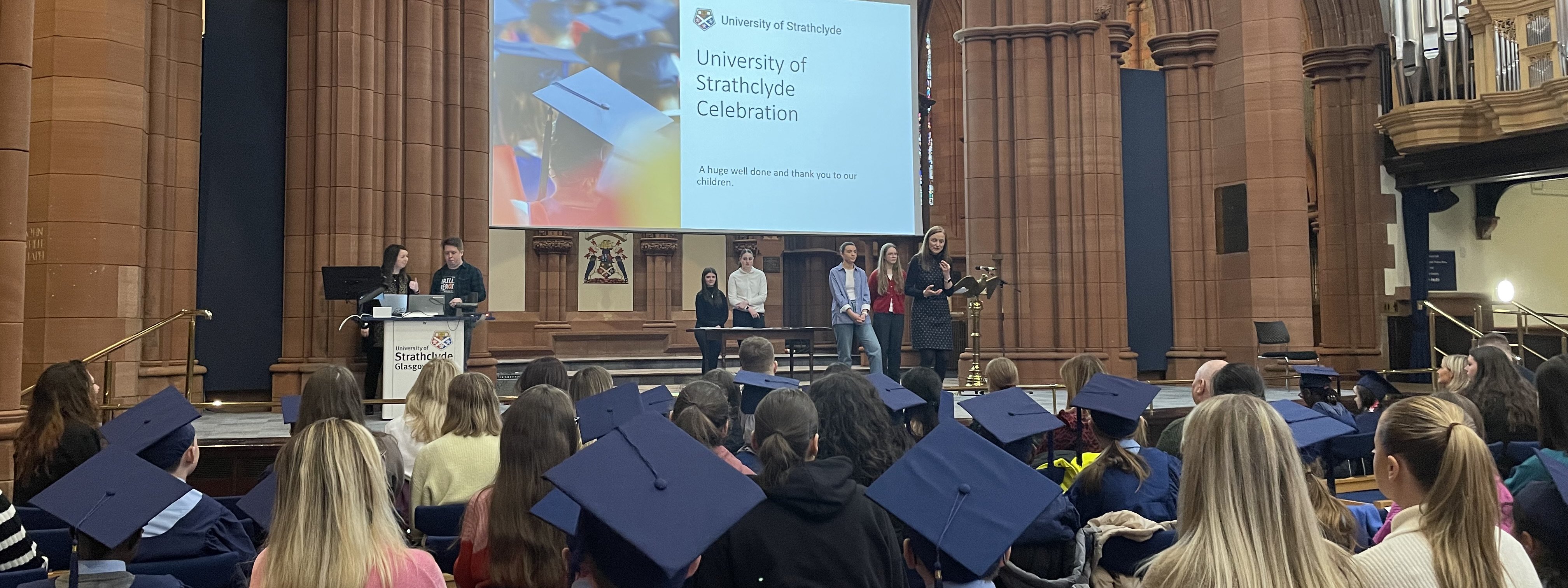 	id:1816368literacyandnumeracyclinic_1600x600 Literacy and Numeracy Clinic leader Jenny Carey addresses school pupils during their graduation ceremony at the Barony Hall
